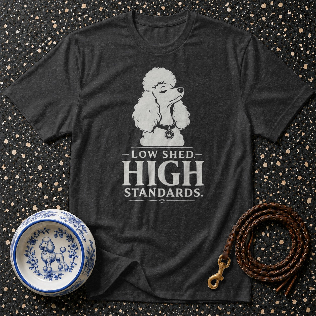Dark t-shirt with poodle graphic stating "Low Shed, High Standards."