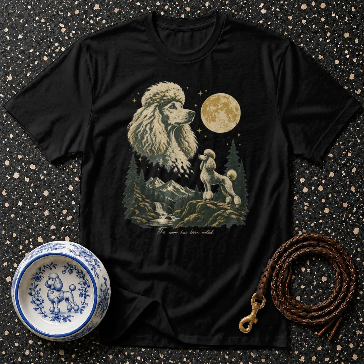 Black t-shirt with a graphic of two poodles and a moon over mountains.