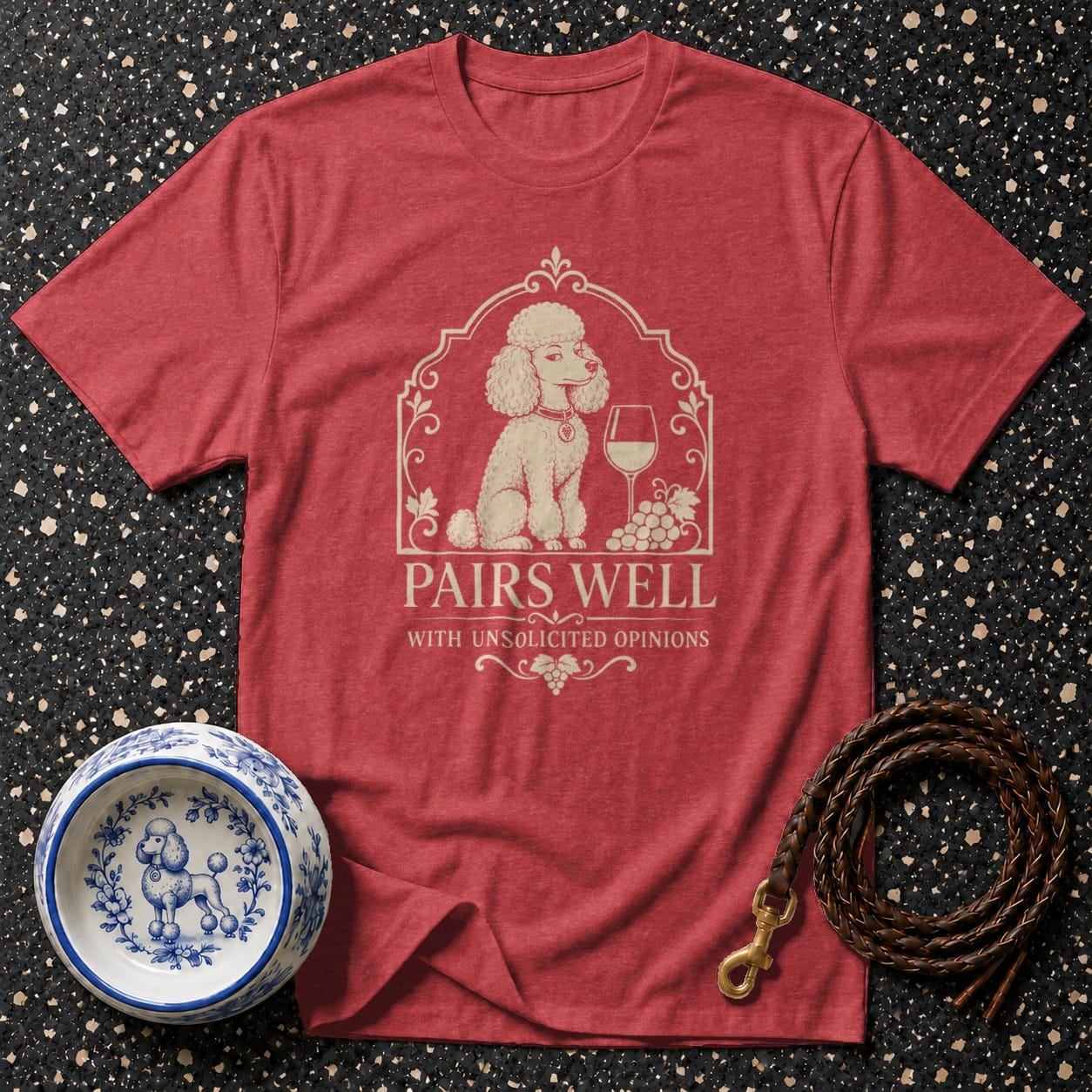 Red t-shirt with a poodle, wine glass, grapes, and text: "Pairs Well With Unsolicited Opinions."