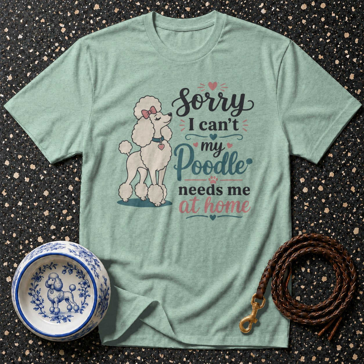 Light green t-shirt with white poodle graphic and text "Sorry I can't, my Poodle needs me at home".