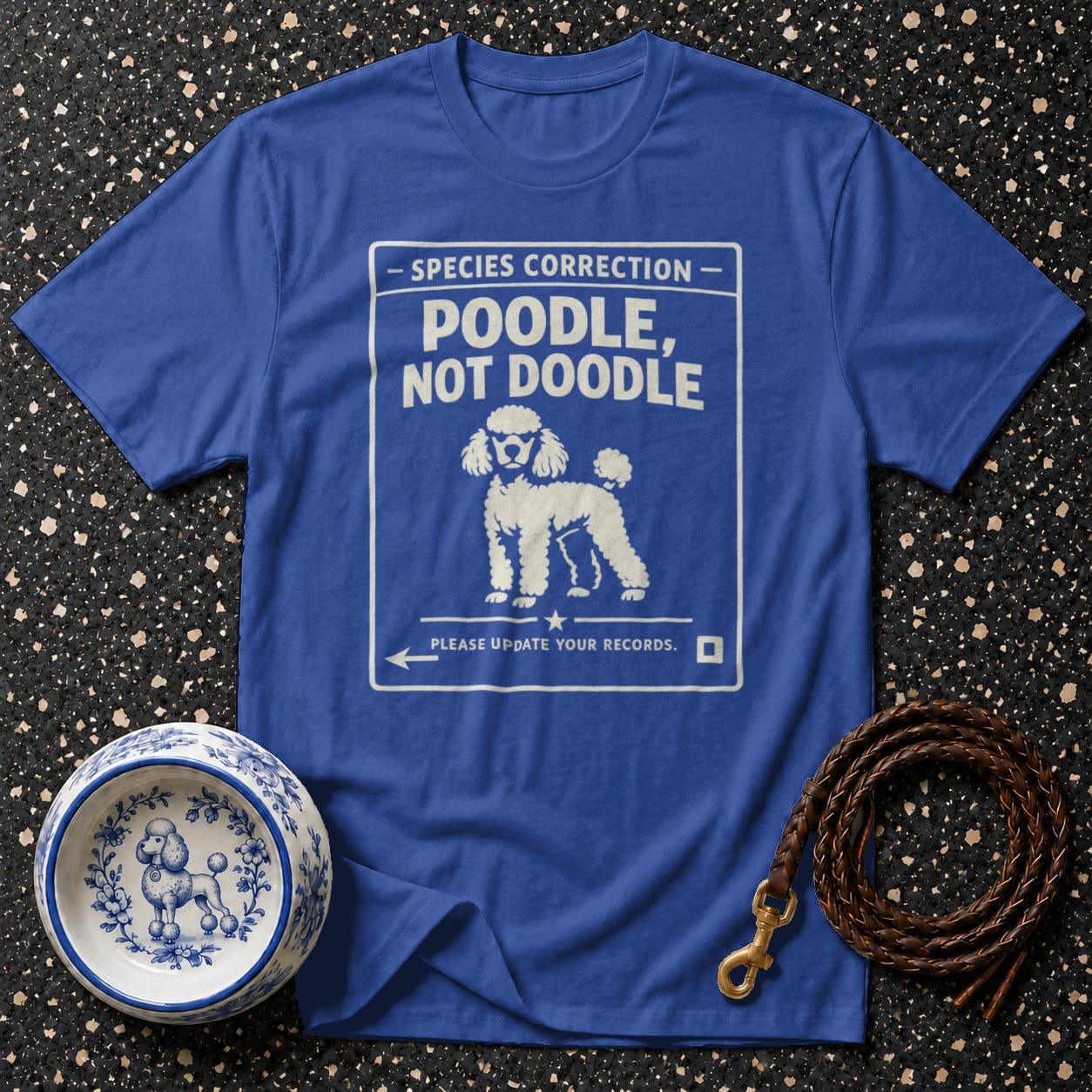Blue t-shirt with "Poodle, Not Doodle" text and poodle illustration.