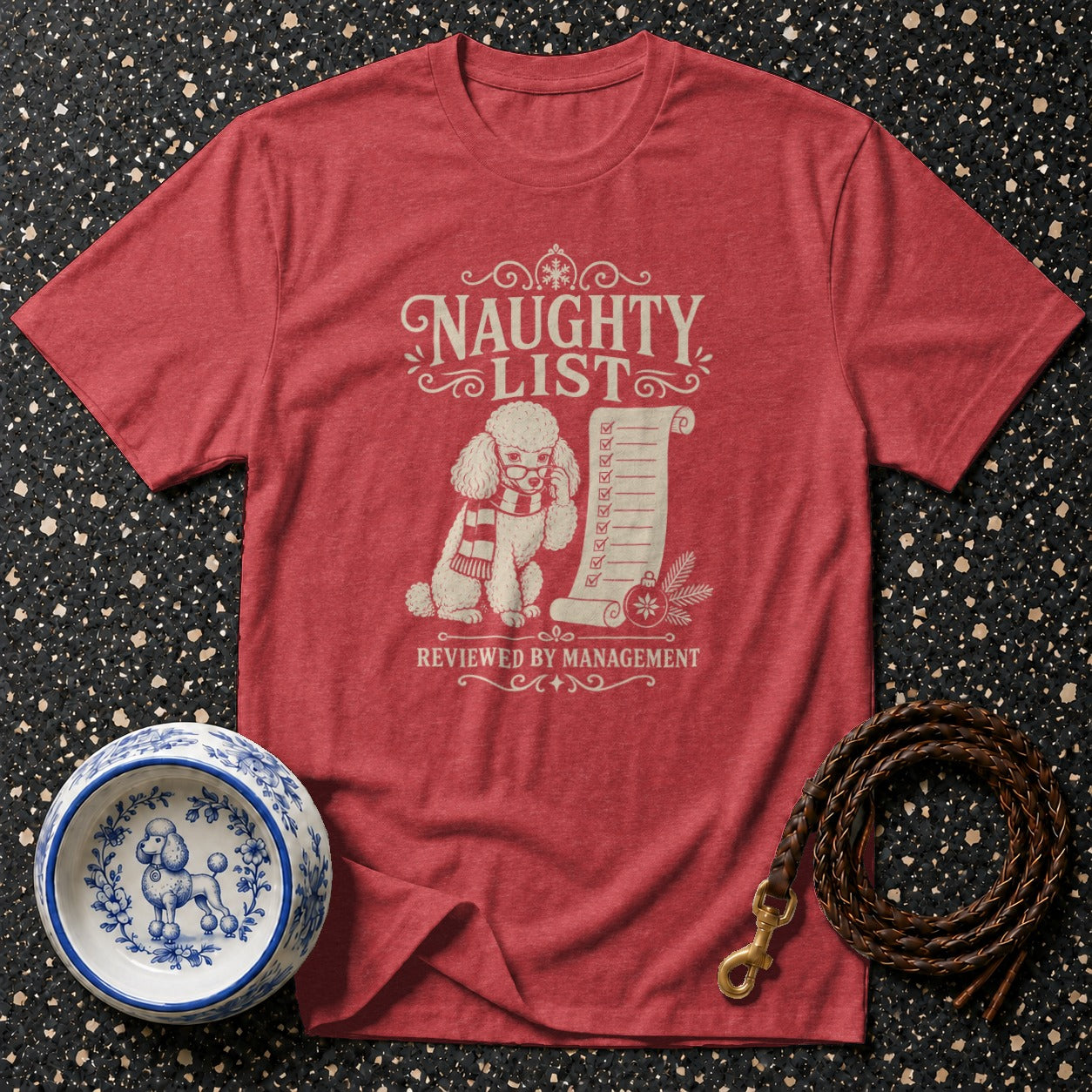 Red t-shirt with white graphic of poodle on naughty list reviewed by management.
