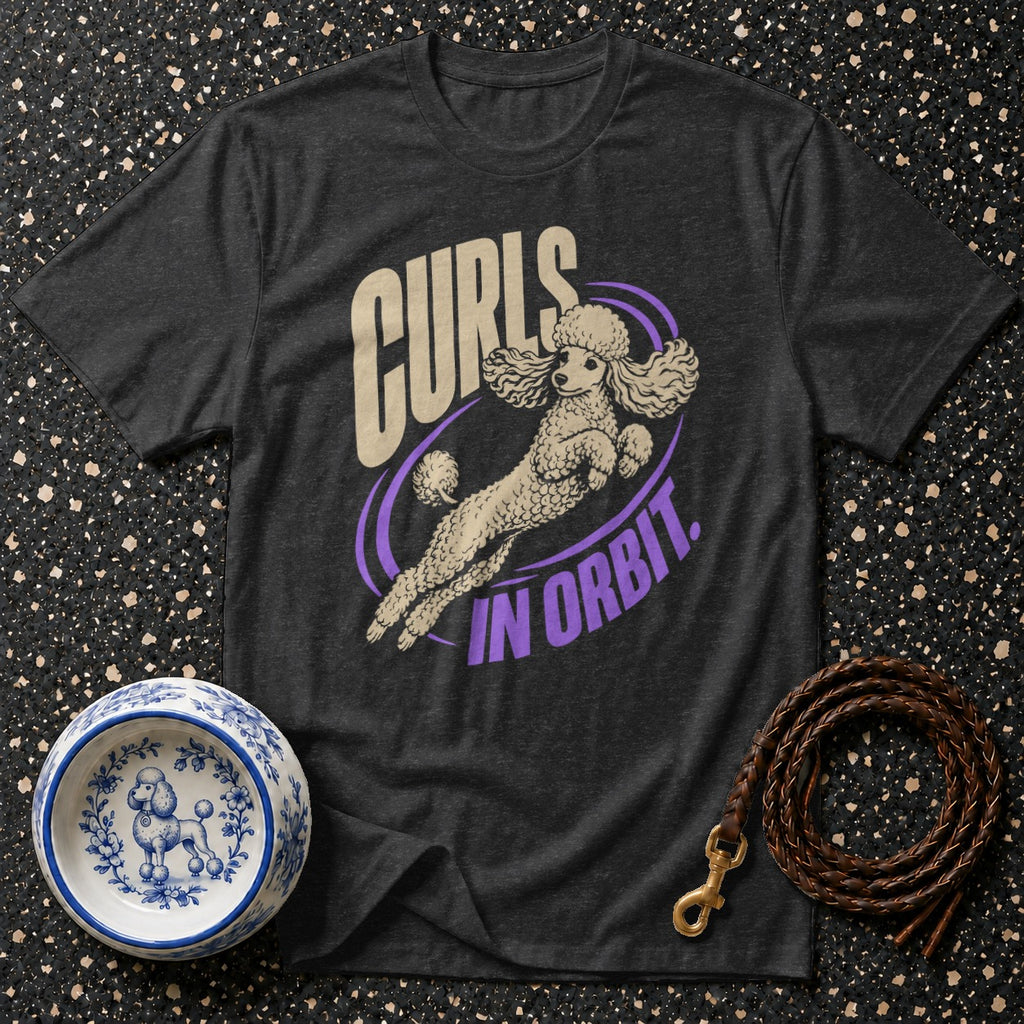 Dark grey t-shirt with a poodle graphic and text "Curls In Orbit."