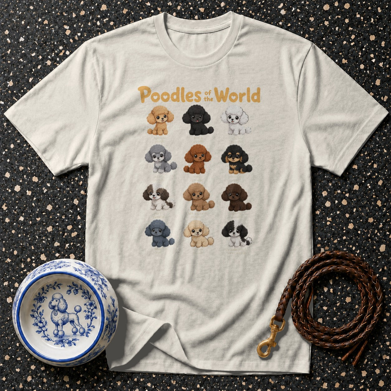 T-shirt with "Poodles of the World" text and twelve cartoon poodles in various colors.