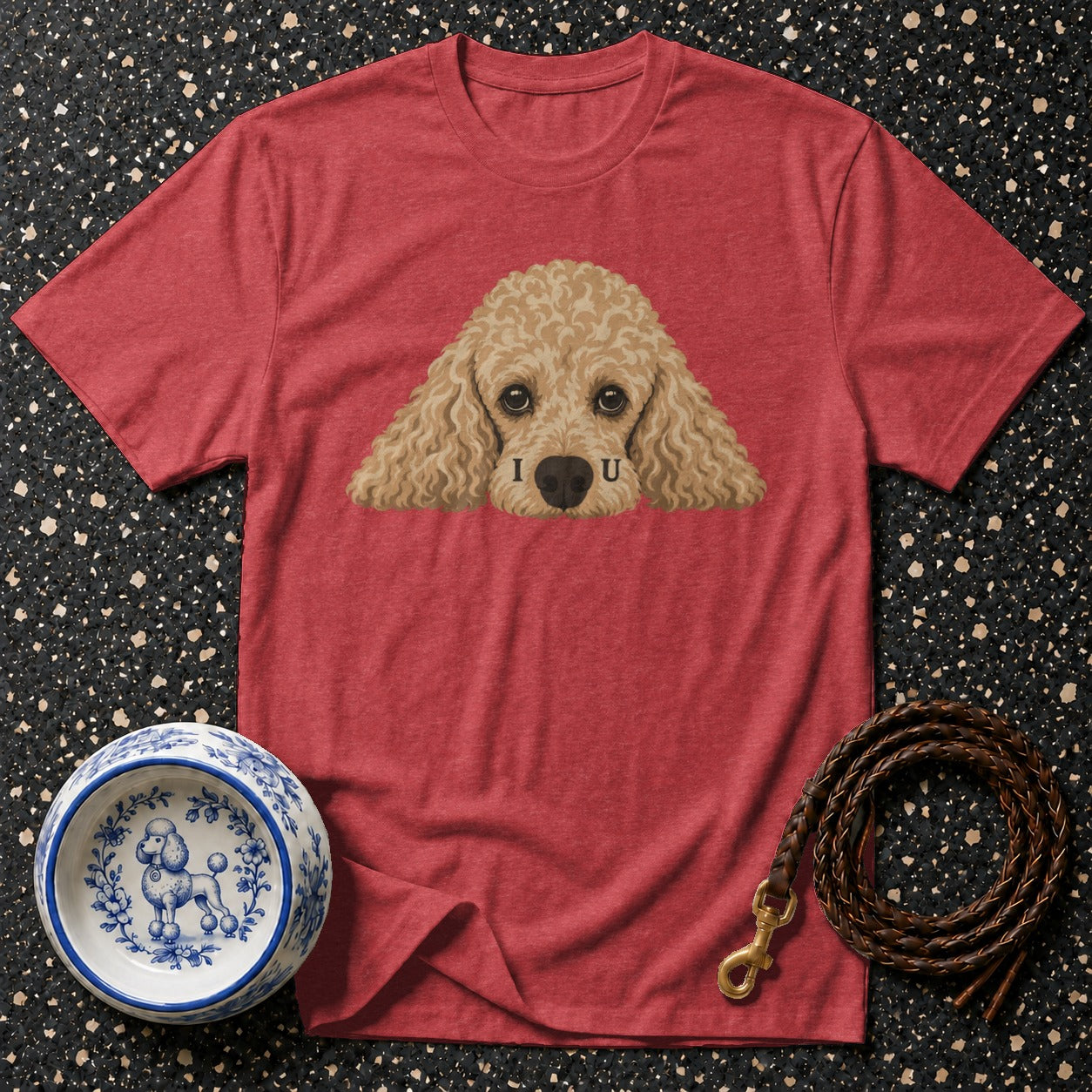 Red t-shirt with poodle graphic and "I U" text, dog bowl, and leash.