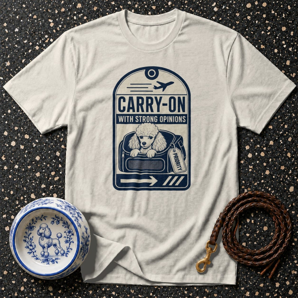 White t-shirt with a poodle in a carrier graphic that reads "CARRY-ON WITH STRONG OPINIONS".