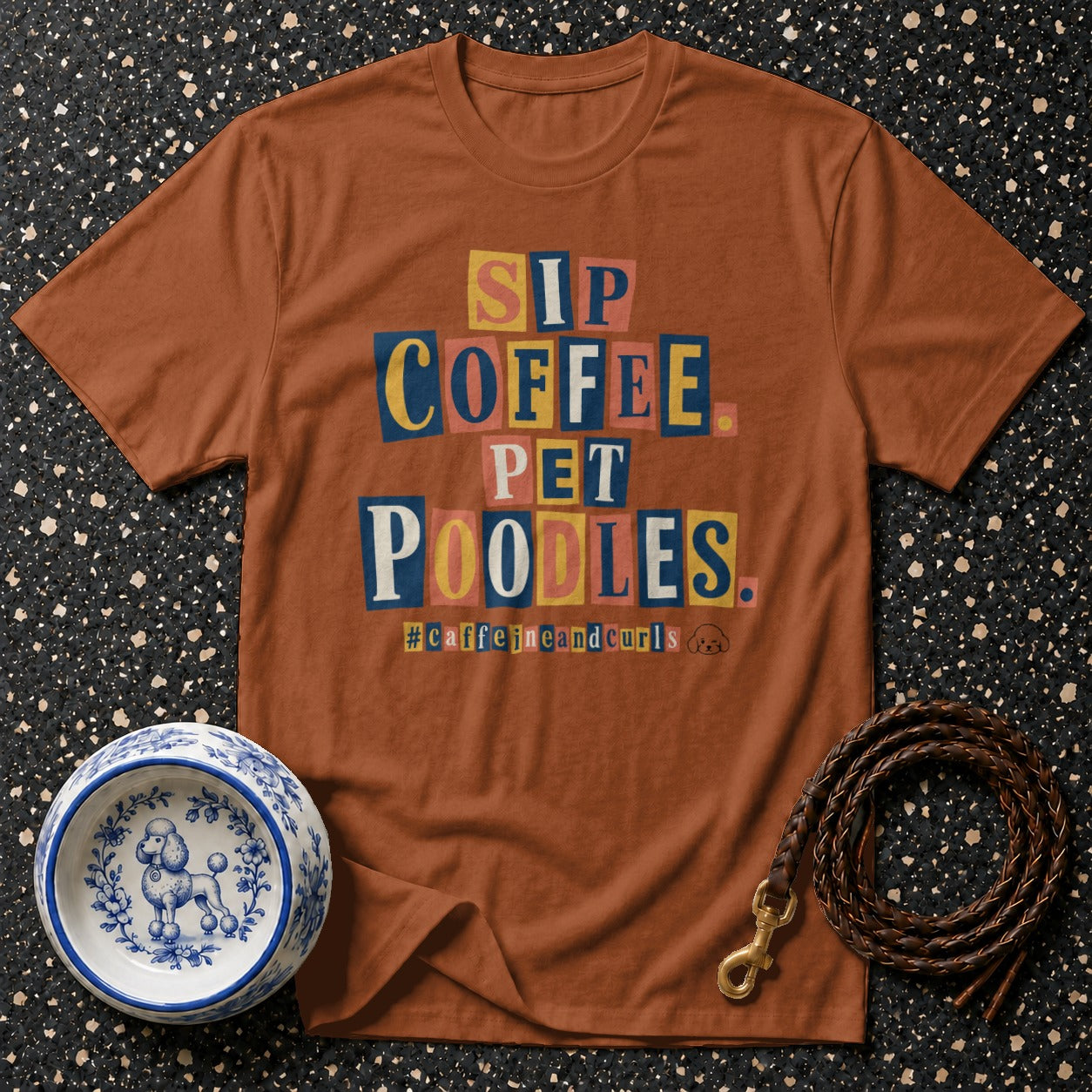 Brown t-shirt with "Sip Coffee Pet Poodles" text and hashtag #caffeineandcurls.