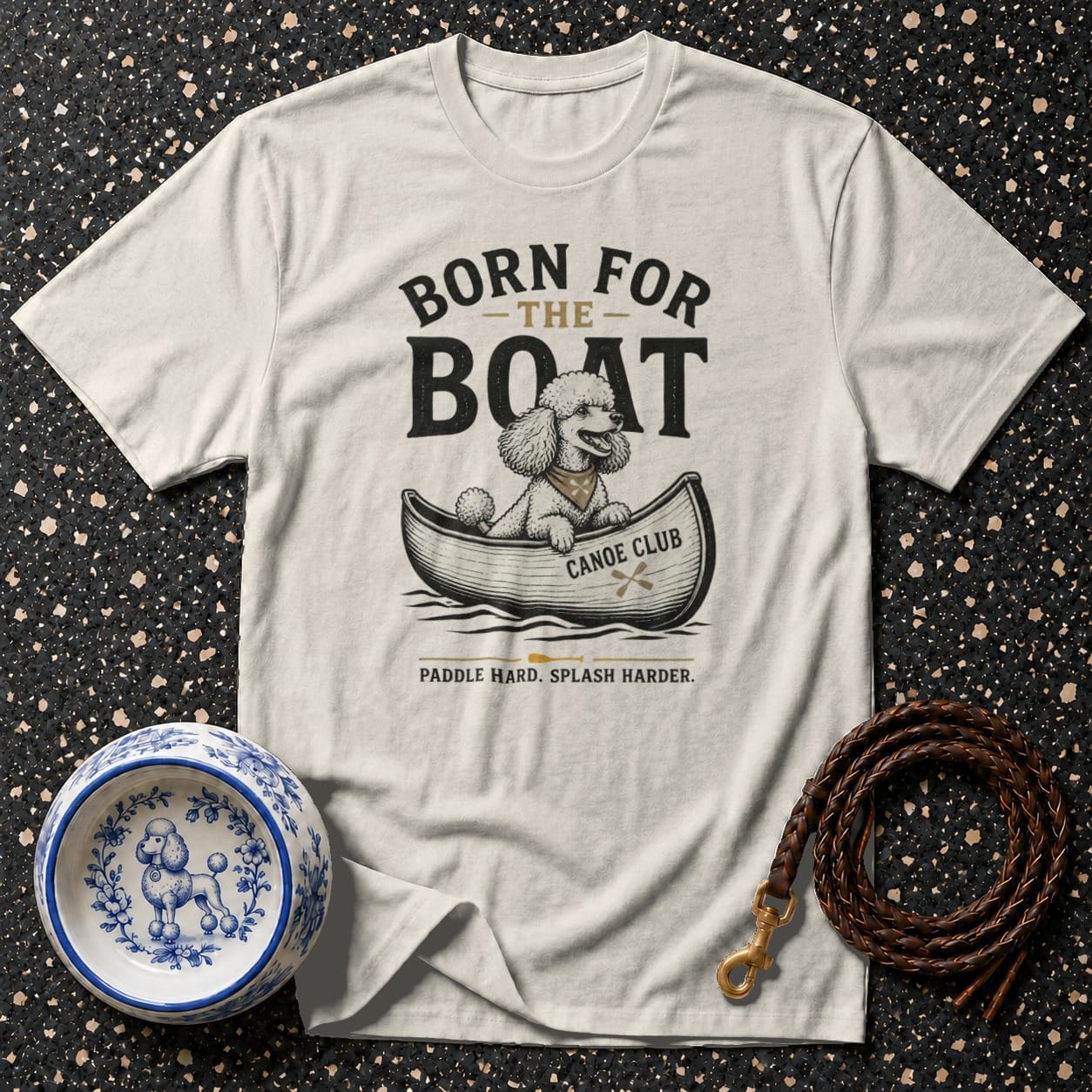 T-shirt with a poodle in a canoe graphic; text says "Born for the Boat".