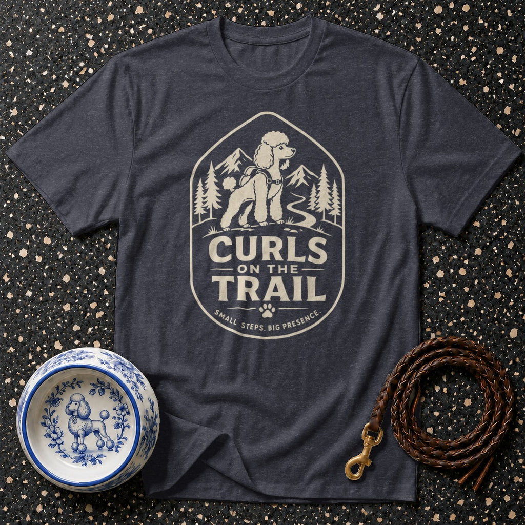 Dark t-shirt with a graphic of a poodle on a trail, reading "Curls On The Trail".