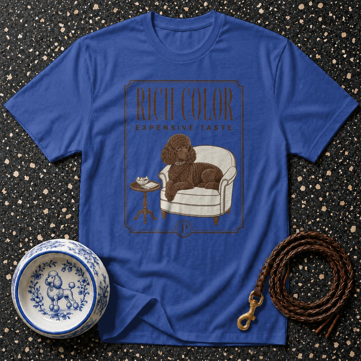 Blue t-shirt with a P-logo, text "RICH COLOR EXPENSIVE TASTE", and dog illustration.