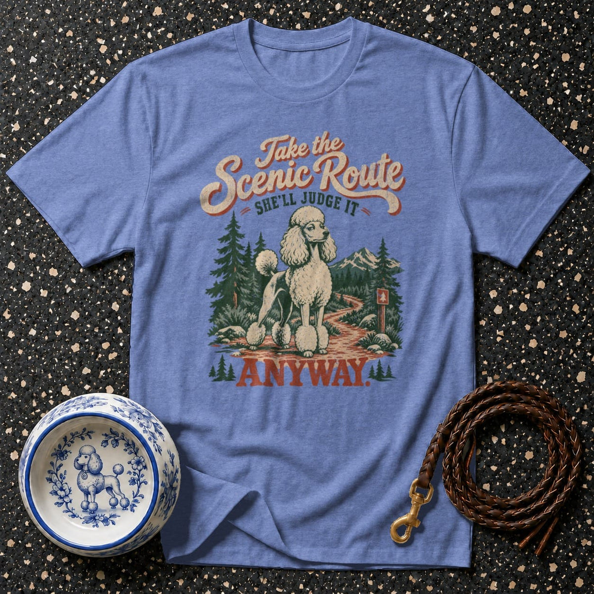 Blue t-shirt with graphic of a poodle on a scenic route, text "Take the Scenic Route She'll Judge It Anyway."