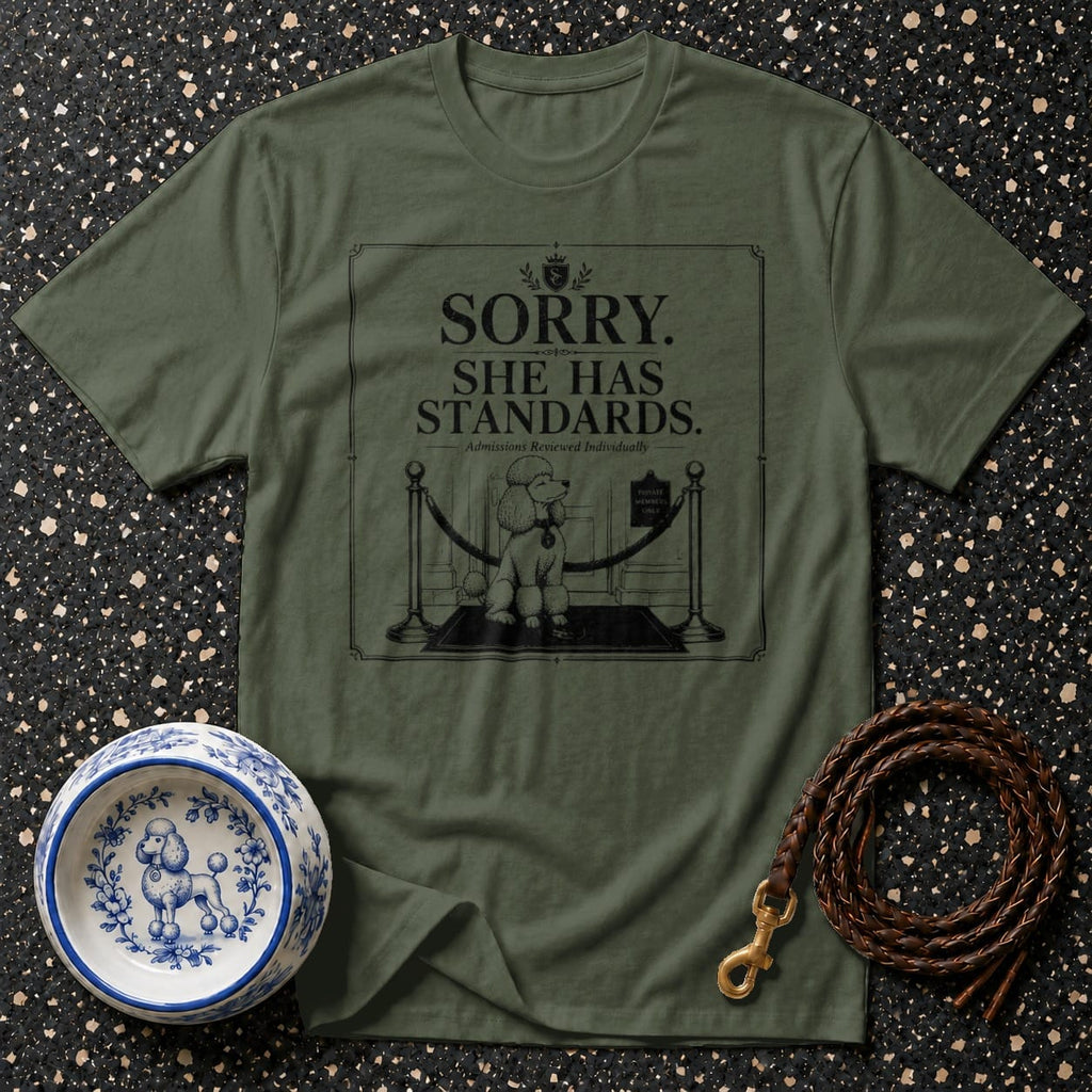Olive green t-shirt with a graphic of a poodle and text saying "Sorry. She has standards."