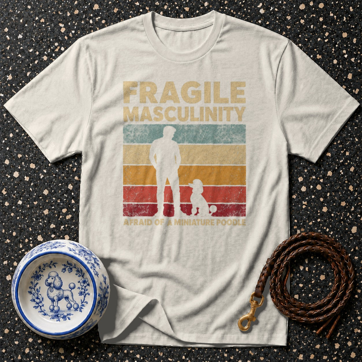 T-shirt with "Fragile Masculinity Afraid of a Miniature Poodle" text, male and poodle silhouette.