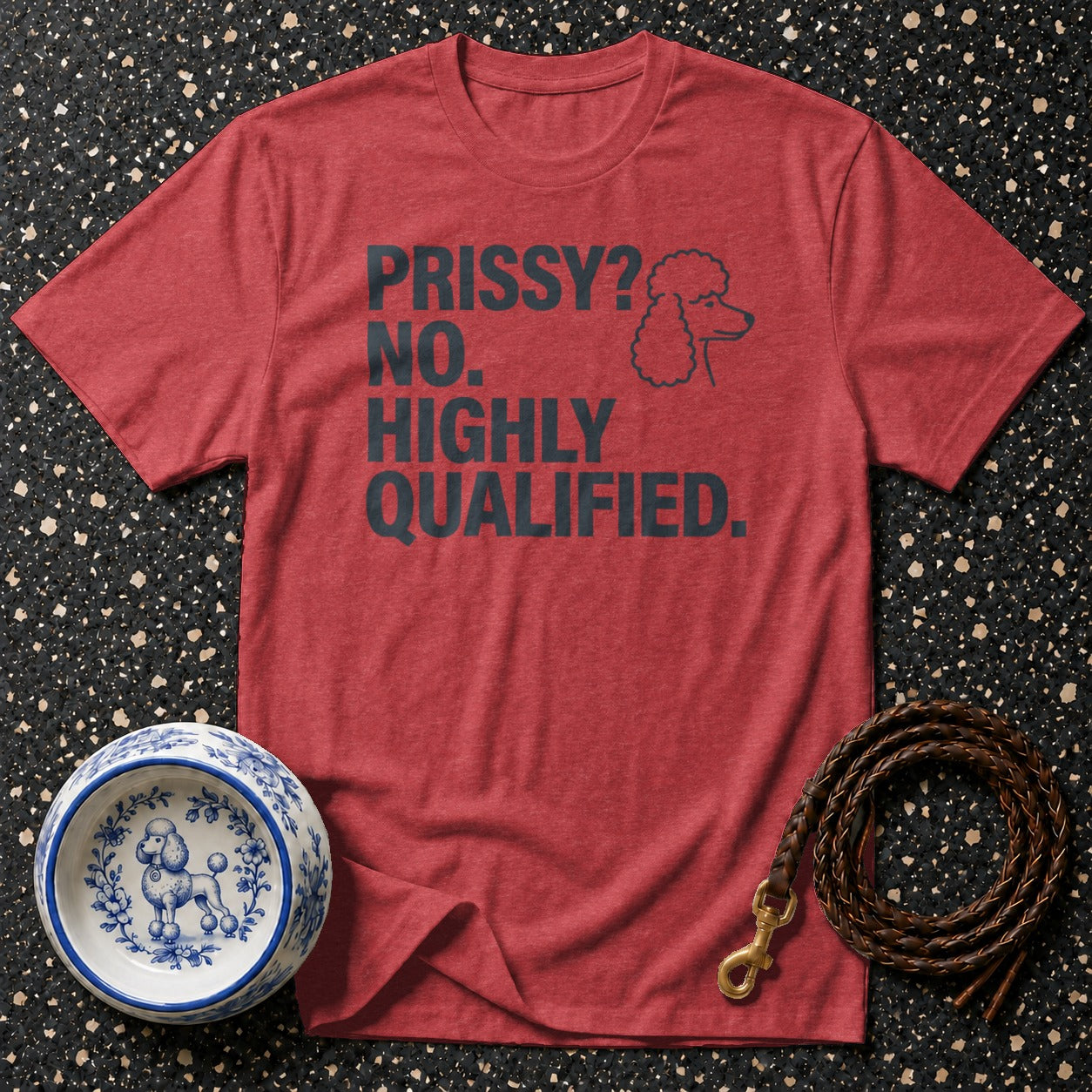 Red t-shirt with "PRISSY? NO. HIGHLY QUALIFIED." text and poodle graphic.