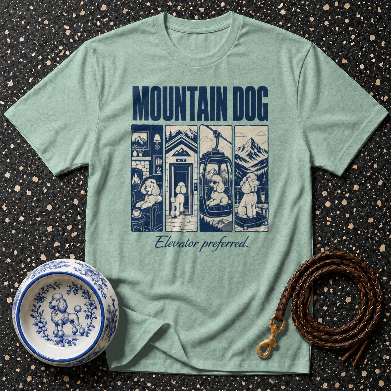 T-shirt with "Mountain Dog" text and poodle in elevator/gondola scenes.
