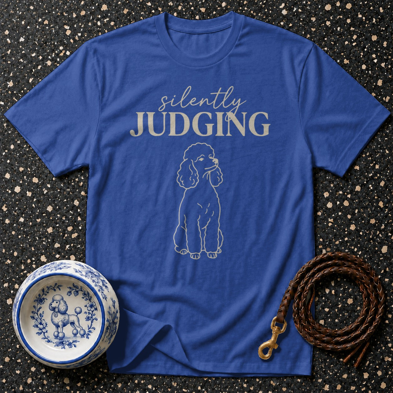 Blue t-shirt with "Silently Judging" text and a poodle outline.