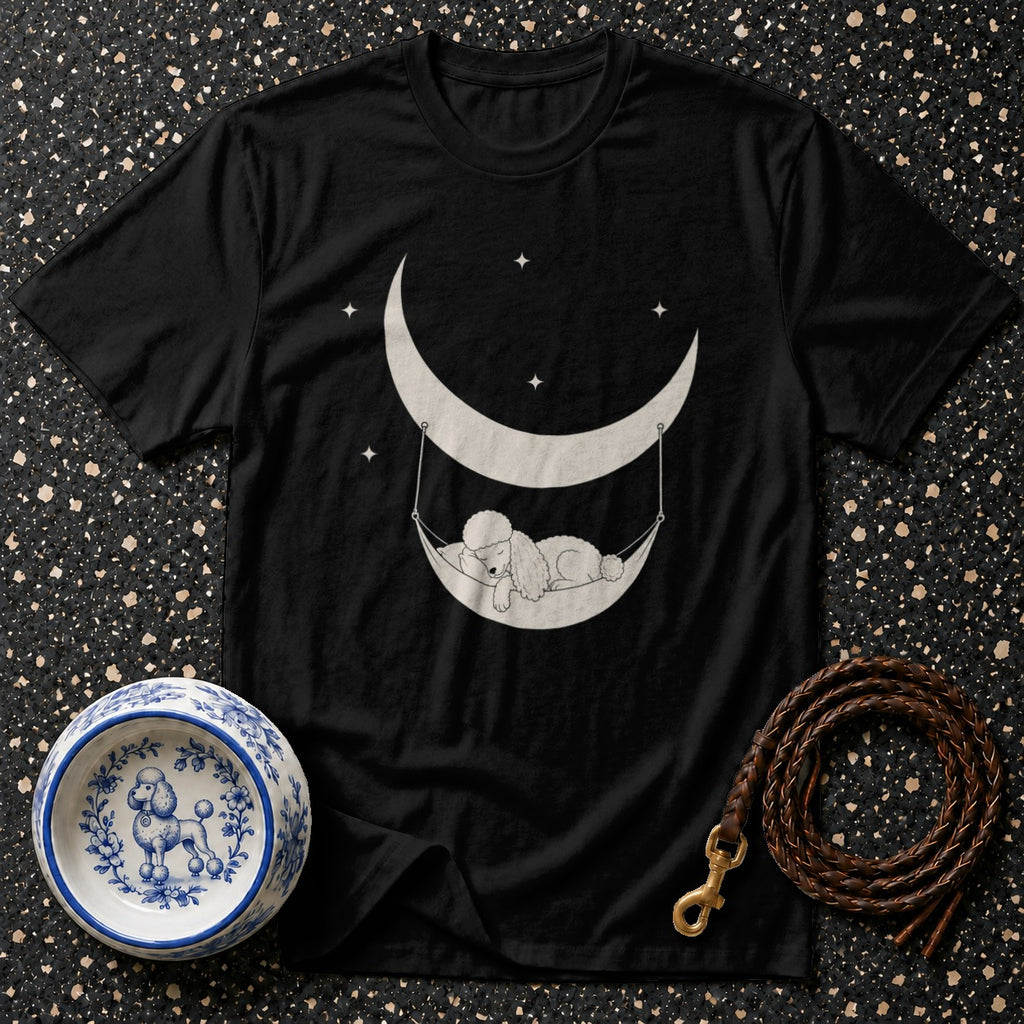 Black t-shirt with graphic of a poodle sleeping in a hammock on a crescent moon.
