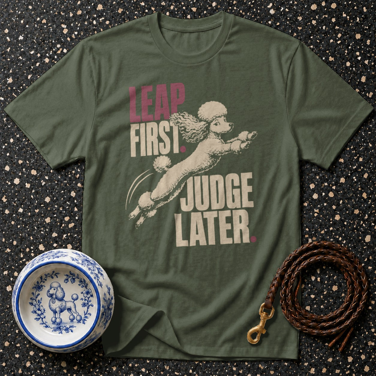 Green t-shirt with "LEAP FIRST JUDGE LATER" text and poodle graphic.