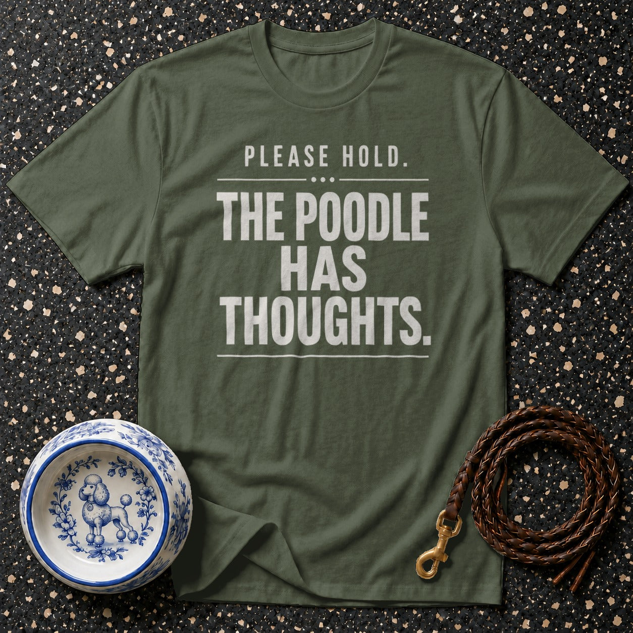 Green t-shirt with "PLEASE HOLD. THE POODLE HAS THOUGHTS." text.