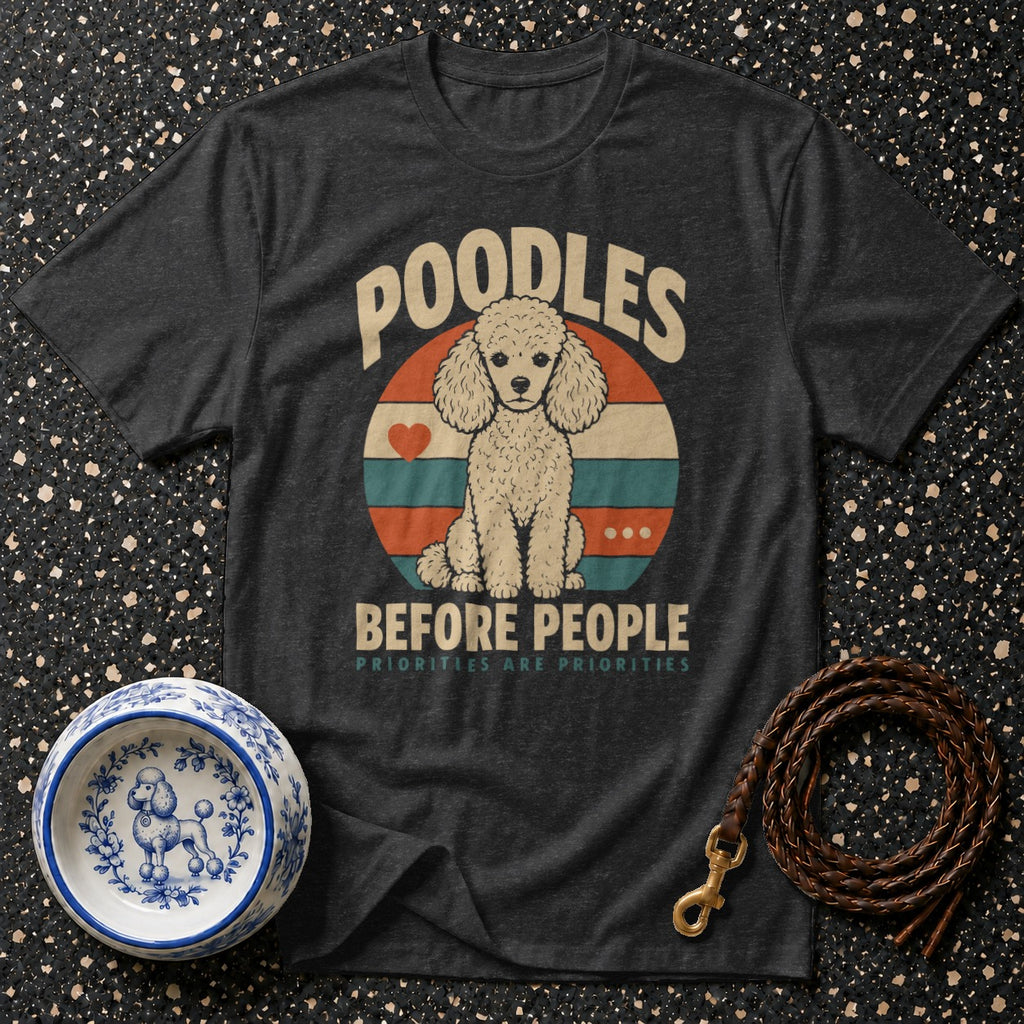 Dark t-shirt with a vintage graphic of a poodle sitting in a circle with text "Poodles Before People".