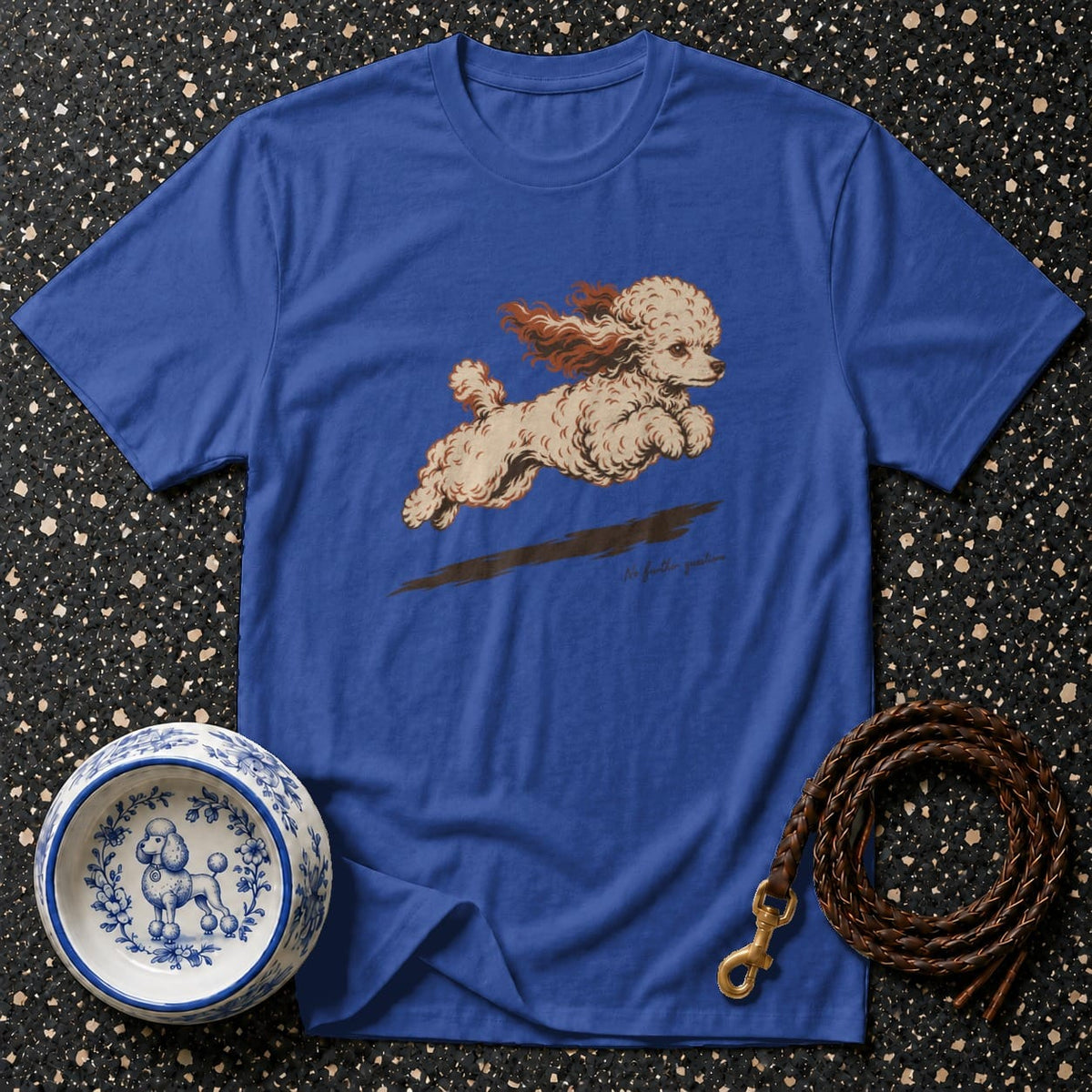 Blue t-shirt with a graphic of a running poodle, alongside a decorative dog bowl and leather leash.