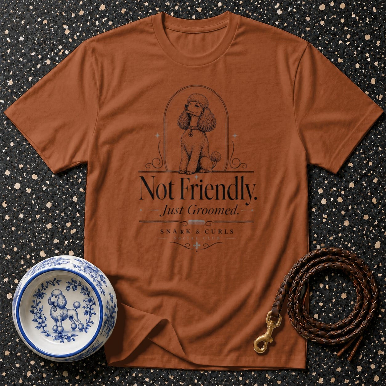Brown t-shirt with poodle graphic and "Not Friendly. Just Groomed." text.
