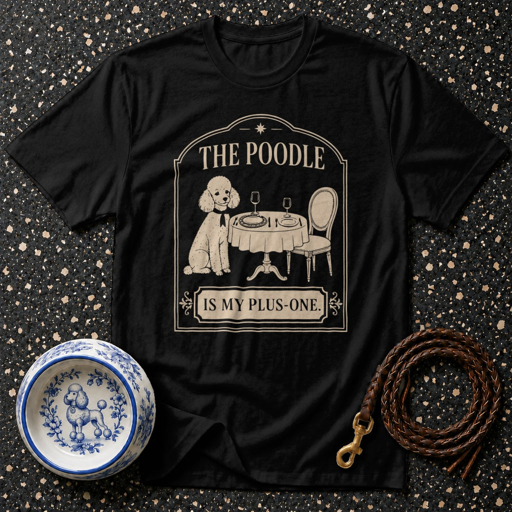 Black t-shirt with a poodle sitting at a table with text "THE POODLE IS MY PLUS-ONE."