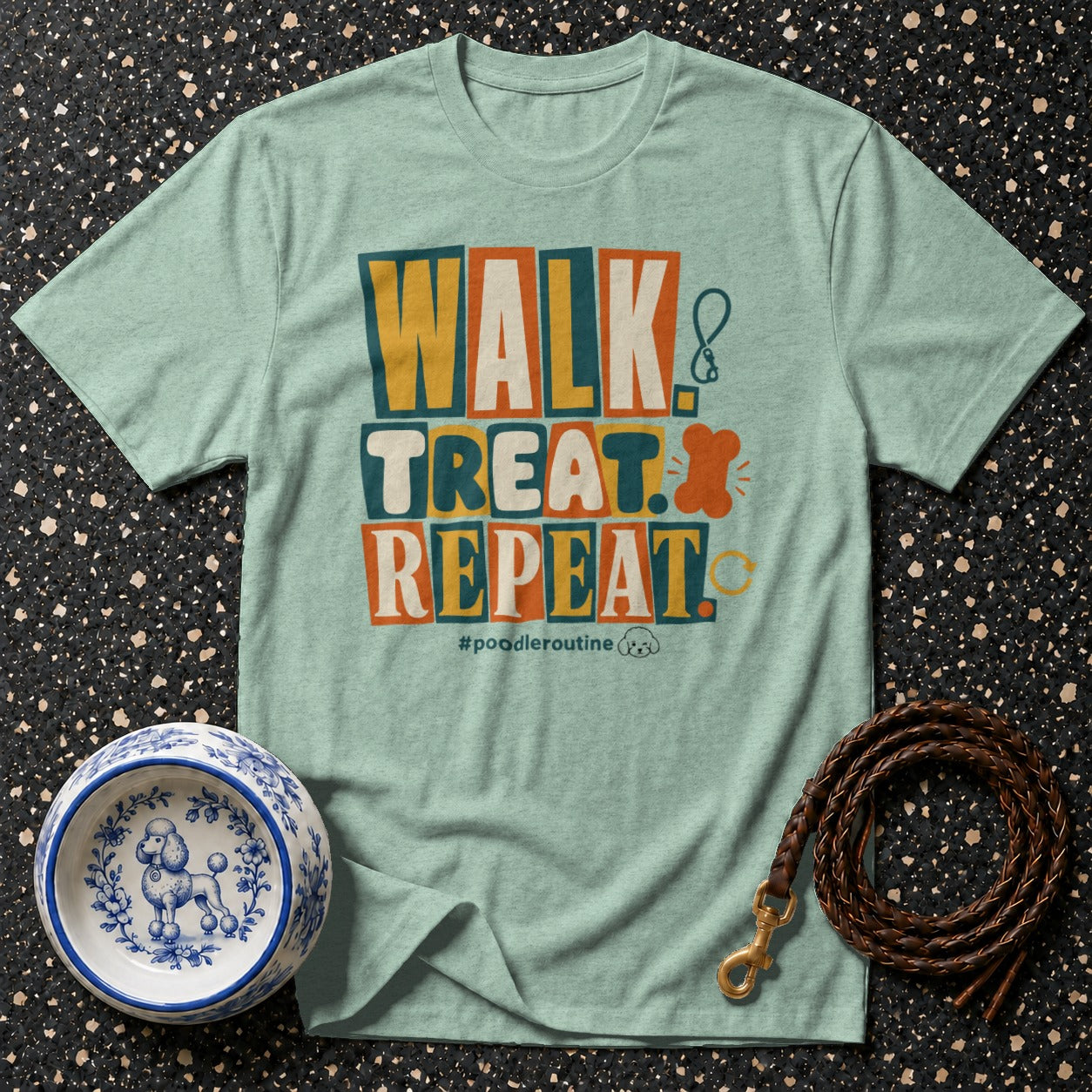 Light blue t-shirt with "Walk Treat Repeat" text and poodle accessories.