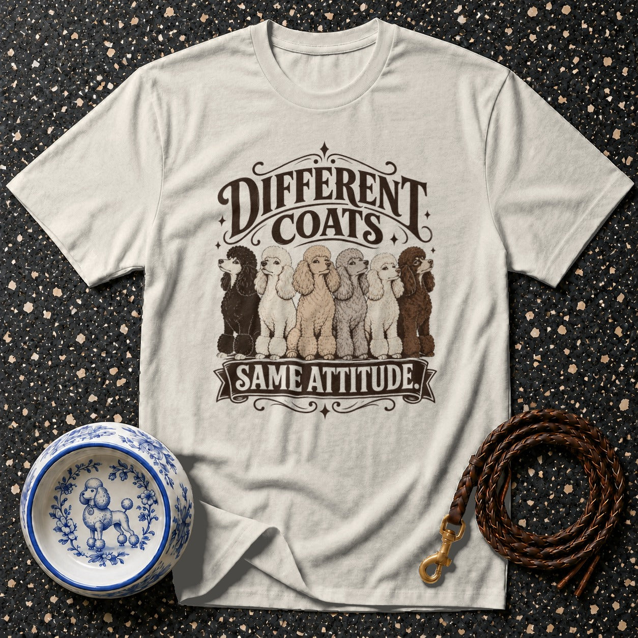 T-shirt graphic with six poodles and text "Different Coats Same Attitude".