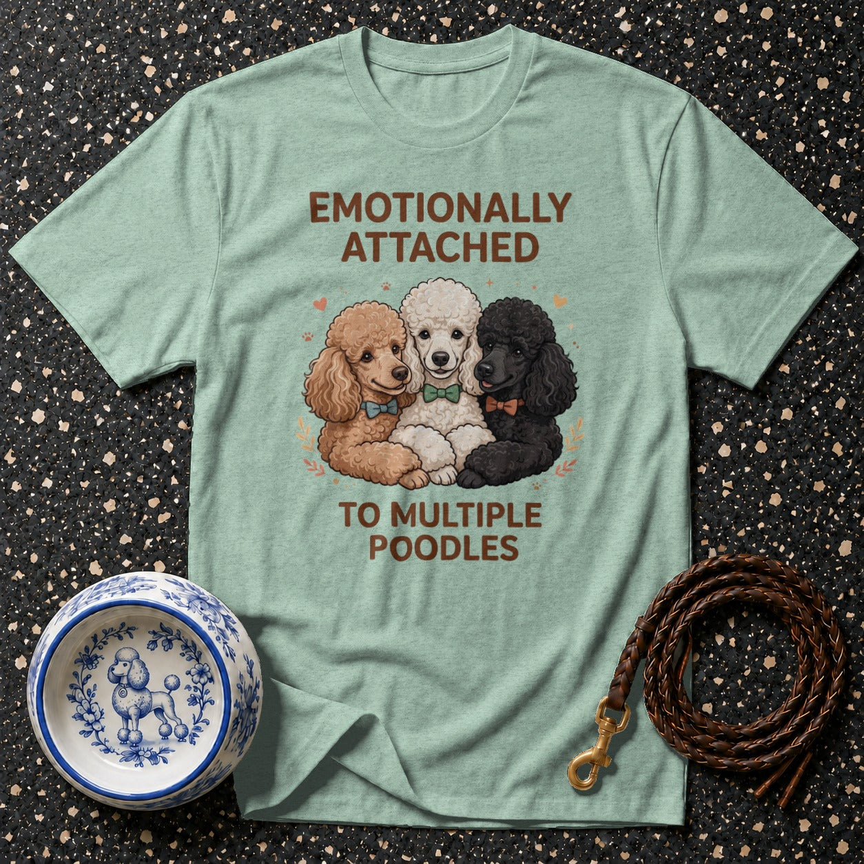 Light blue t-shirt features three poodles and the text "EMOTIONALLY ATTACHED TO MULTIPLE POODLES".