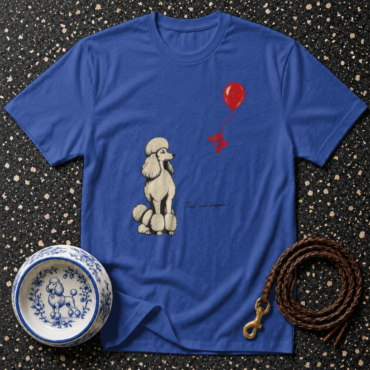 Royal blue t-shirt with a poodle and red balloon graphic and text.