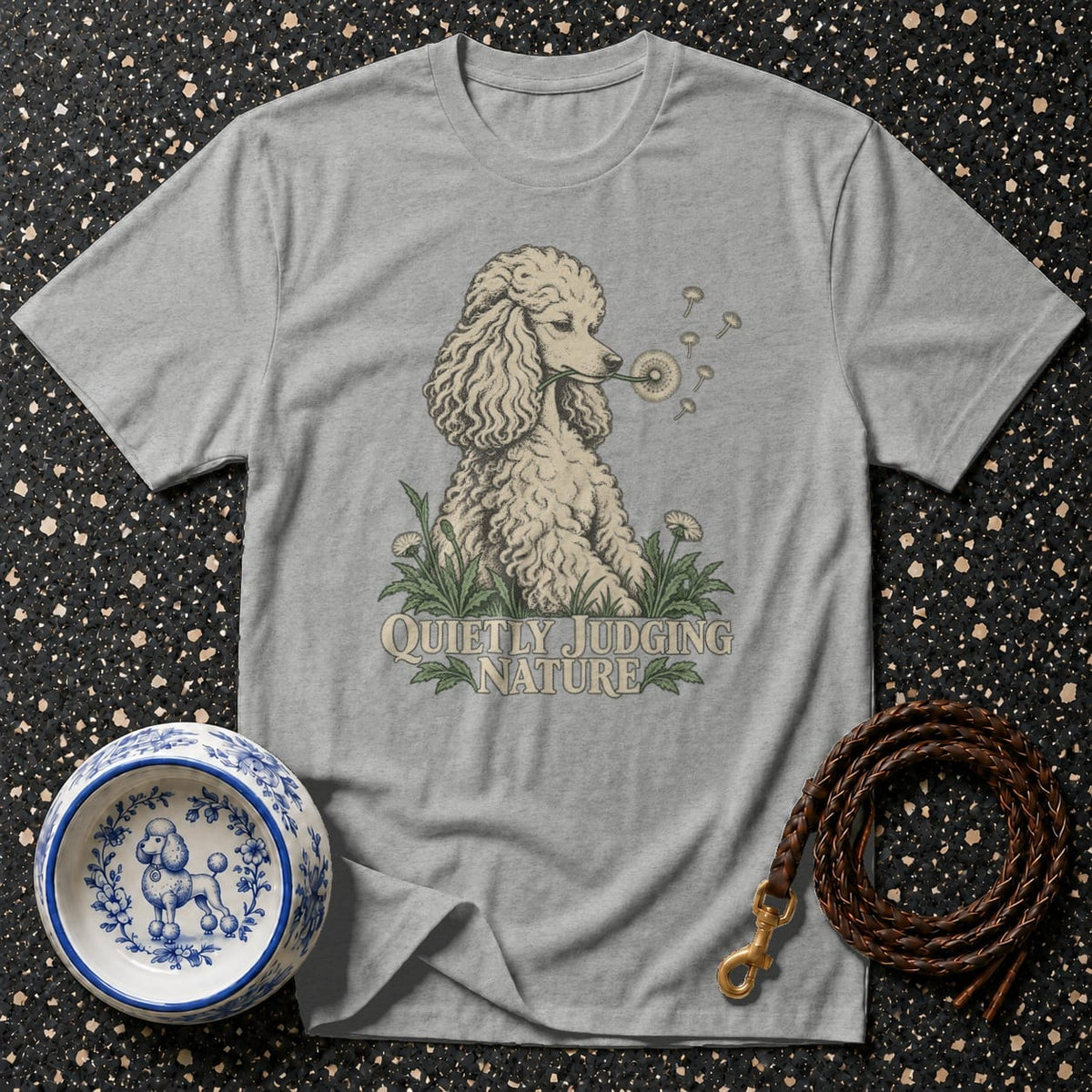 Grey t-shirt with poodle blowing dandelion seeds and text "Quietly Judging Nature."