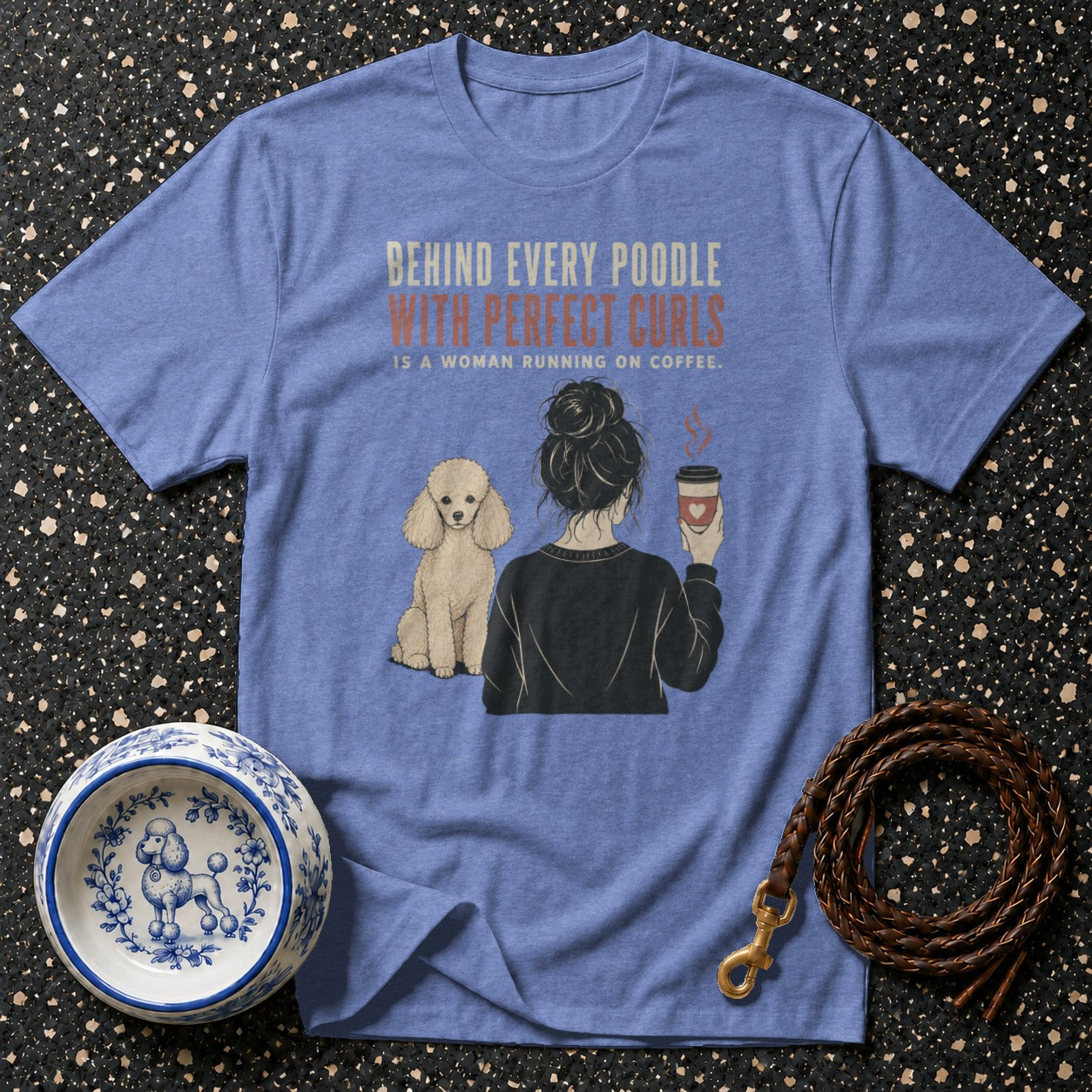 Blue t-shirt with "Behind Every Poodle With Perfect Curls Is A Woman Running On Coffee" graphic.