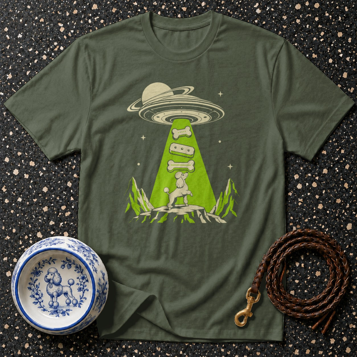 Green t-shirt with poodle being beamed up by a UFO with dog bones.