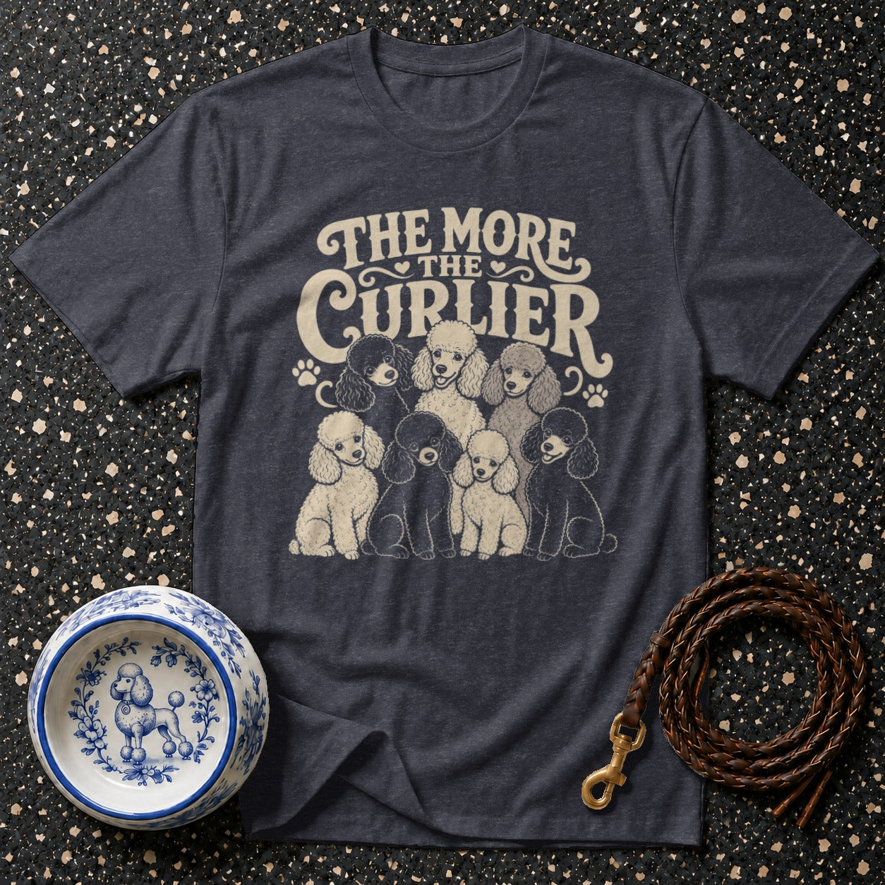 Dark gray t-shirt with cream text "The More The Curier" and poodle illustration.