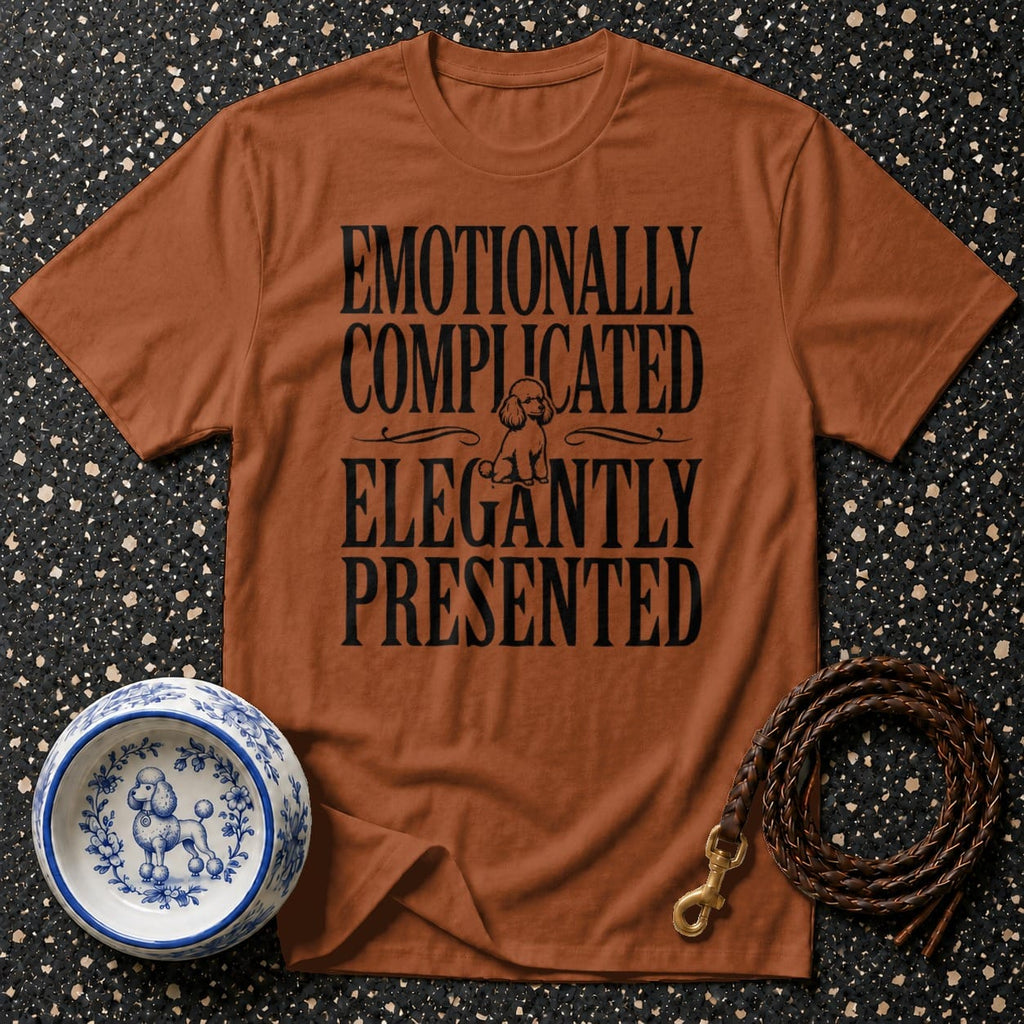 Brown t-shirt with black text "Emotionally Complicated Elegantly Presented" and a poodle graphic.