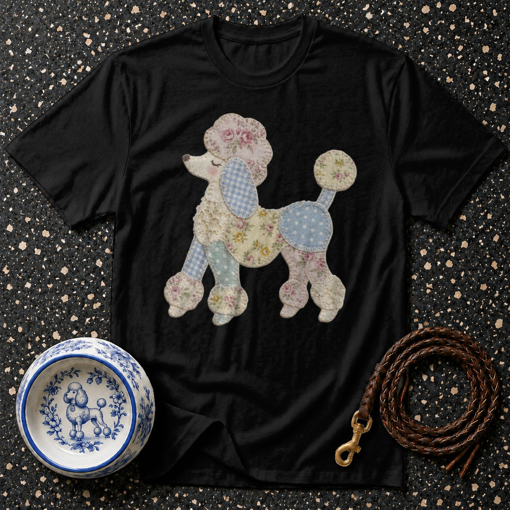 Black t-shirt with a fabric applique poodle and a blue and white dog bowl.
