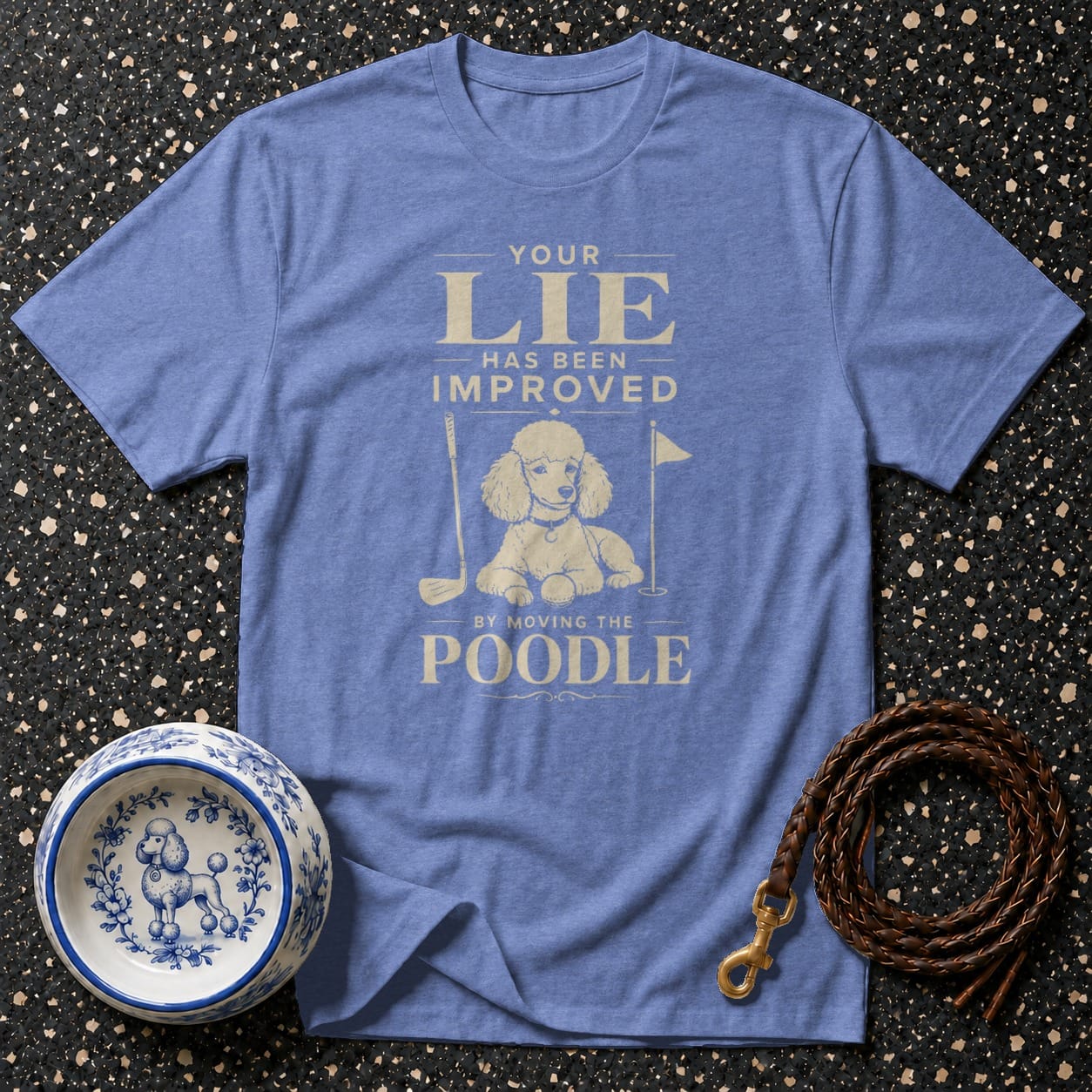 Blue t-shirt with a graphic of a poodle with golf clubs and text.