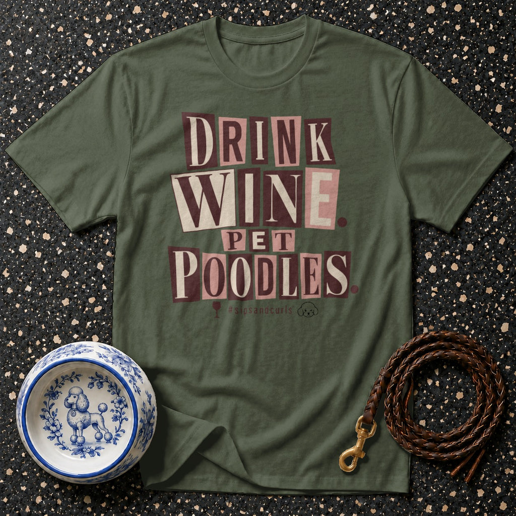 Green t-shirt with "DRINK WINE PET POODLES" text and poodle-themed accessories.