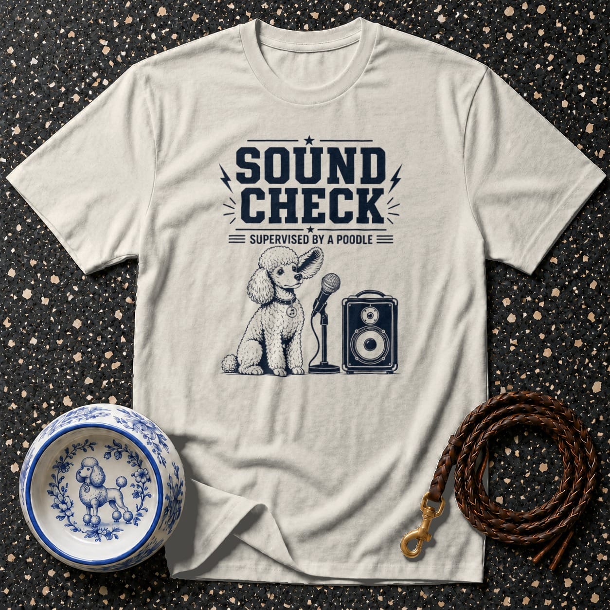 T-shirt with "Sound Check Supervised by a Poodle" text and illustration.