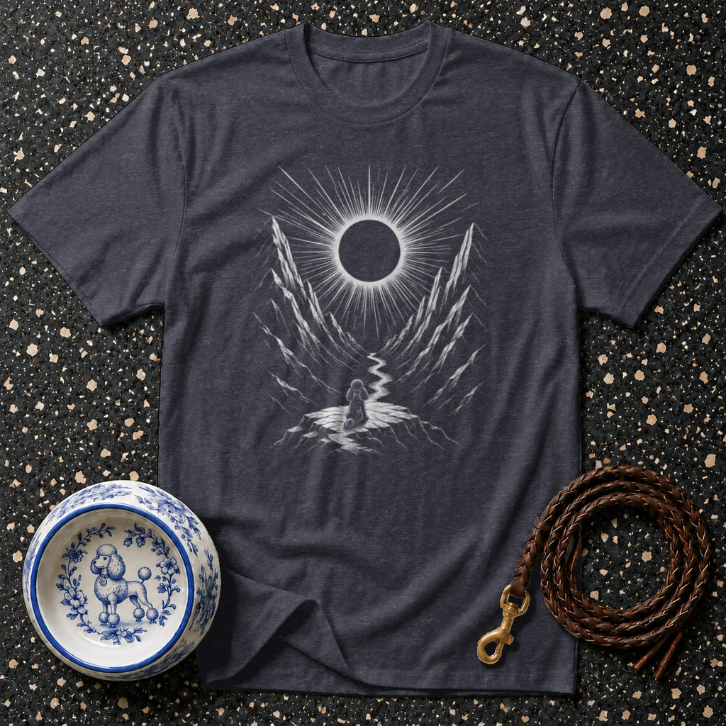 Dark grey t-shirt with a graphic of a figure witnessing a solar eclipse between mountain peaks.