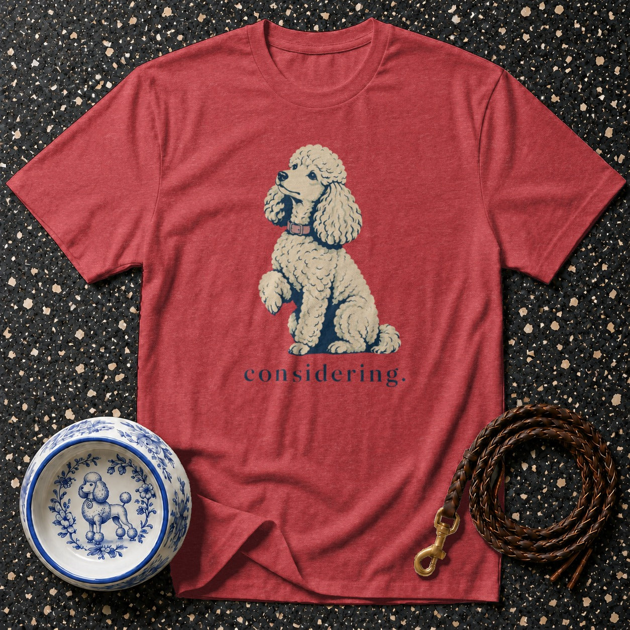 Red t-shirt with a poodle illustration and "considering" text.