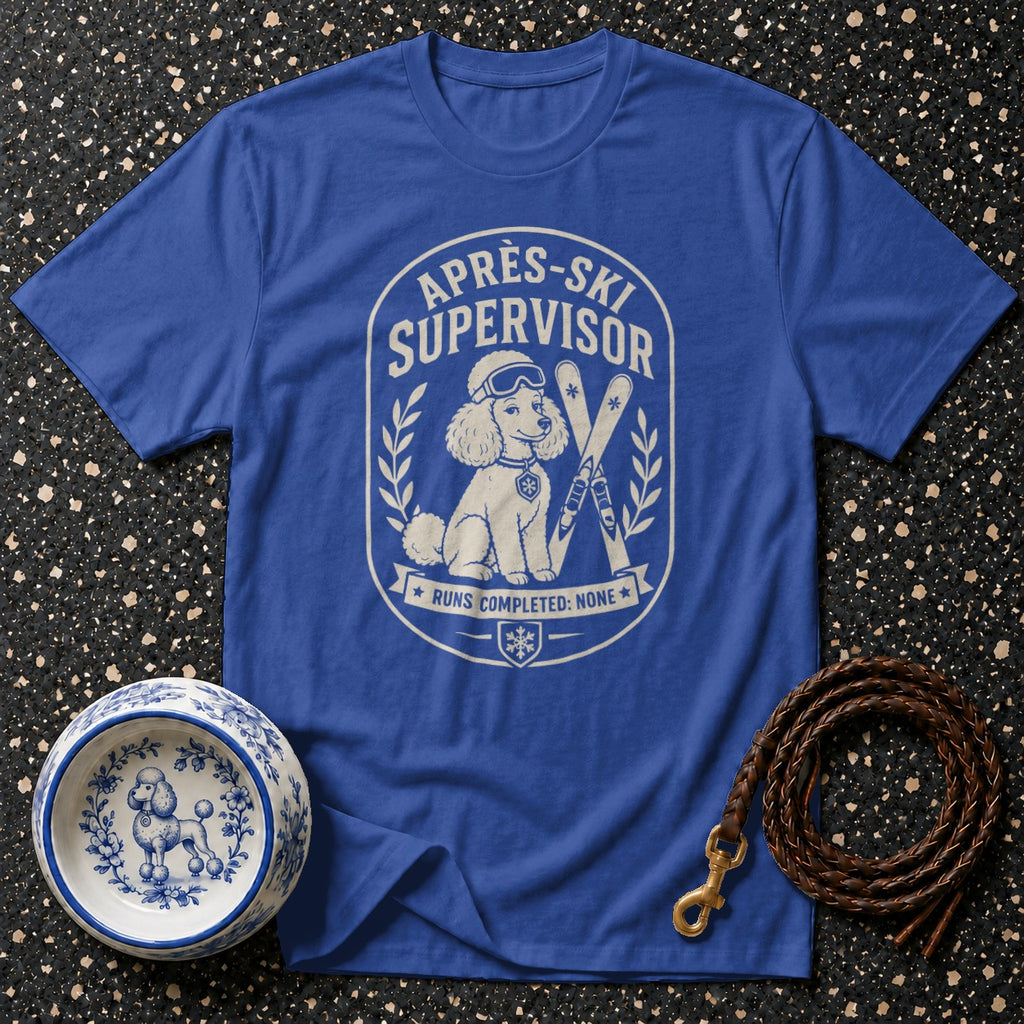 Blue t-shirt with "Après-Ski Supervisor" graphic of a poodle and skis.