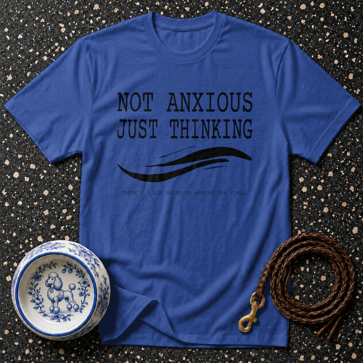Blue t-shirt with black text "NOT ANXIOUS JUST THINKING" and dog imagery.