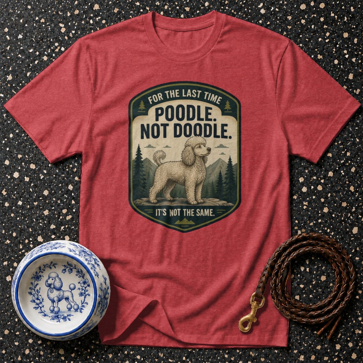 Red t-shirt with poodle graphic and text "Poodle. Not Doodle. It's Not The Same."