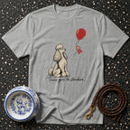 Grey t-shirt with illustration of poodle looking at red balloon and text "There goes the standard."