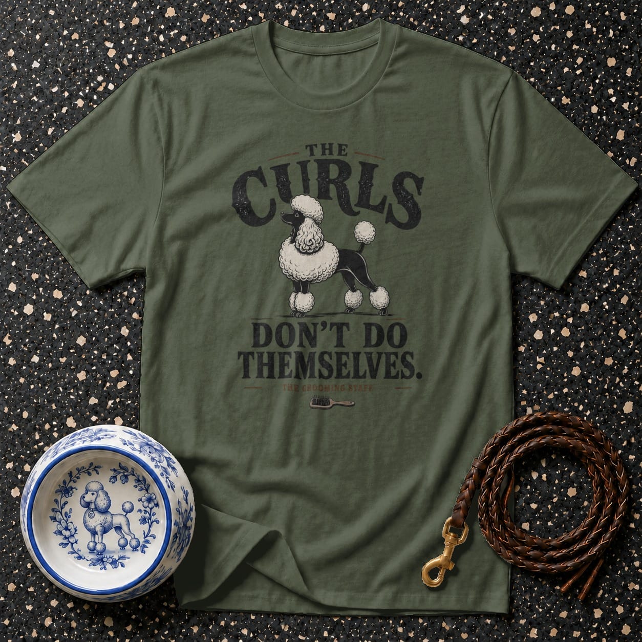 Green t-shirt with a poodle and text "The Curls Don't Do Themselves."