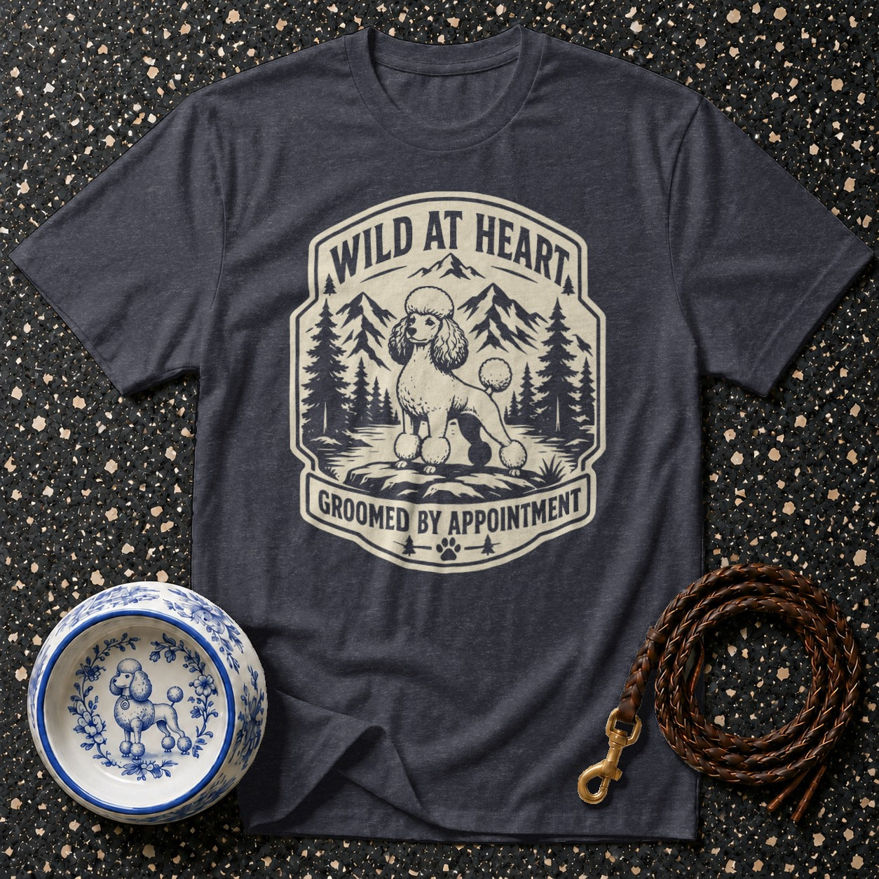 Dark gray t-shirt with a poodle in a mountain landscape graphic that says "Wild at Heart Groomed by Appointment."