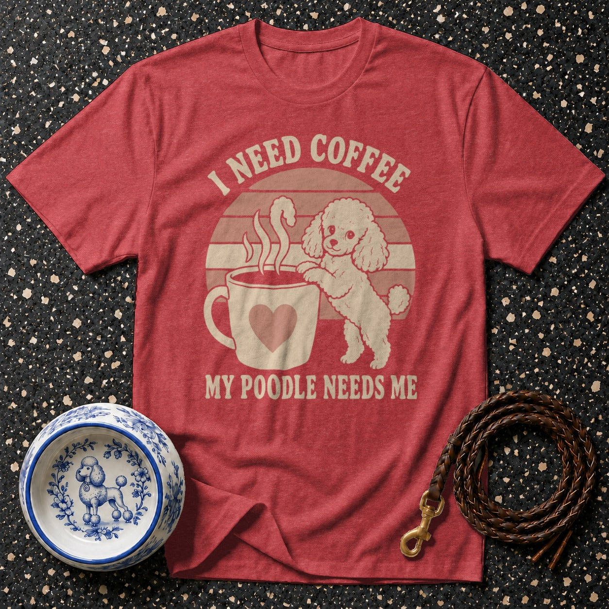 Red t-shirt with cartoon poodle reaching for coffee, "I need coffee my poodle needs me" text.