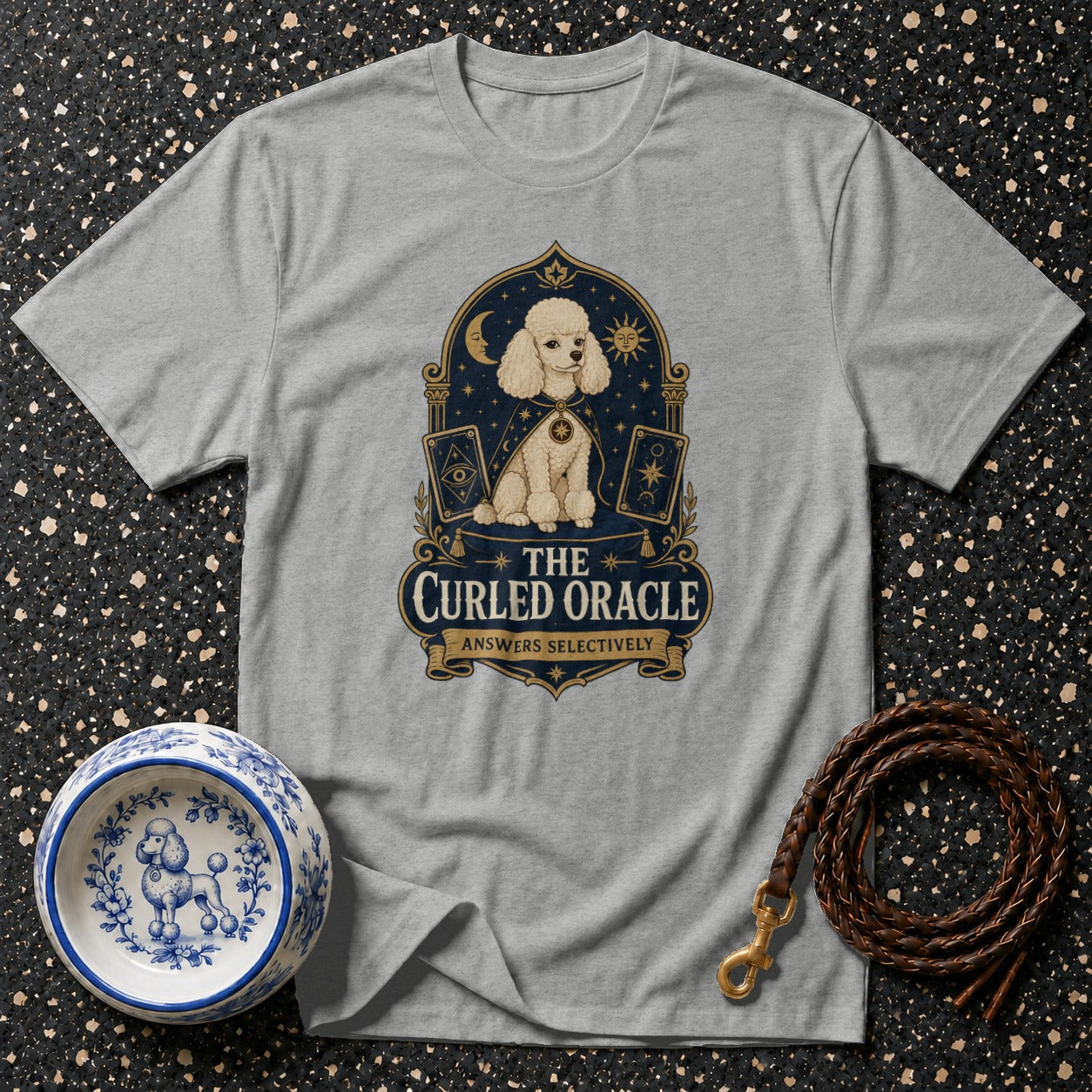 Light gray t-shirt with a poodle oracle tarot card design and text "The Curled Oracle Answers Selectively".